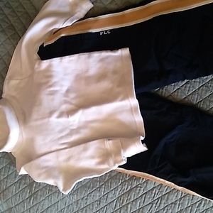 Weather resistant Childrens Place pull on pants with a white turtleneck